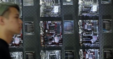 A visitor walks past a motherboard wall during the Computex Show in Taipei on May 30, 2017. (Sam Yeh/AFP/Getty Images)
