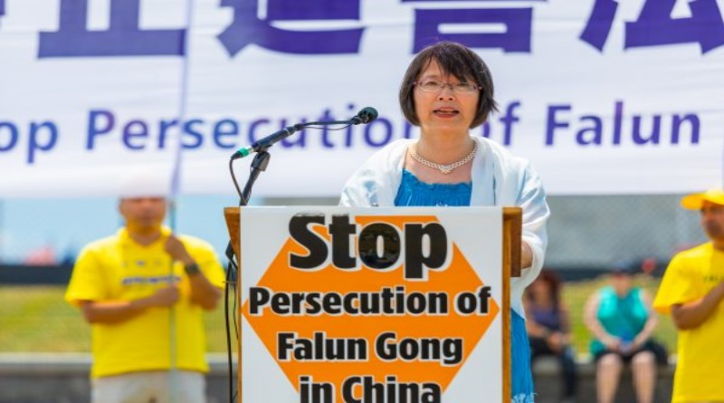 Yuhua Zhang, whose husband Zhenyu Ma is imprisoned in China, speaks at the 19th anniversary of the beginning of the persecution of Falun Gong on July 20, 1999, at the Washington Monument in Washington on July 19, 2018. (Mark Zou/The Epoch Times)